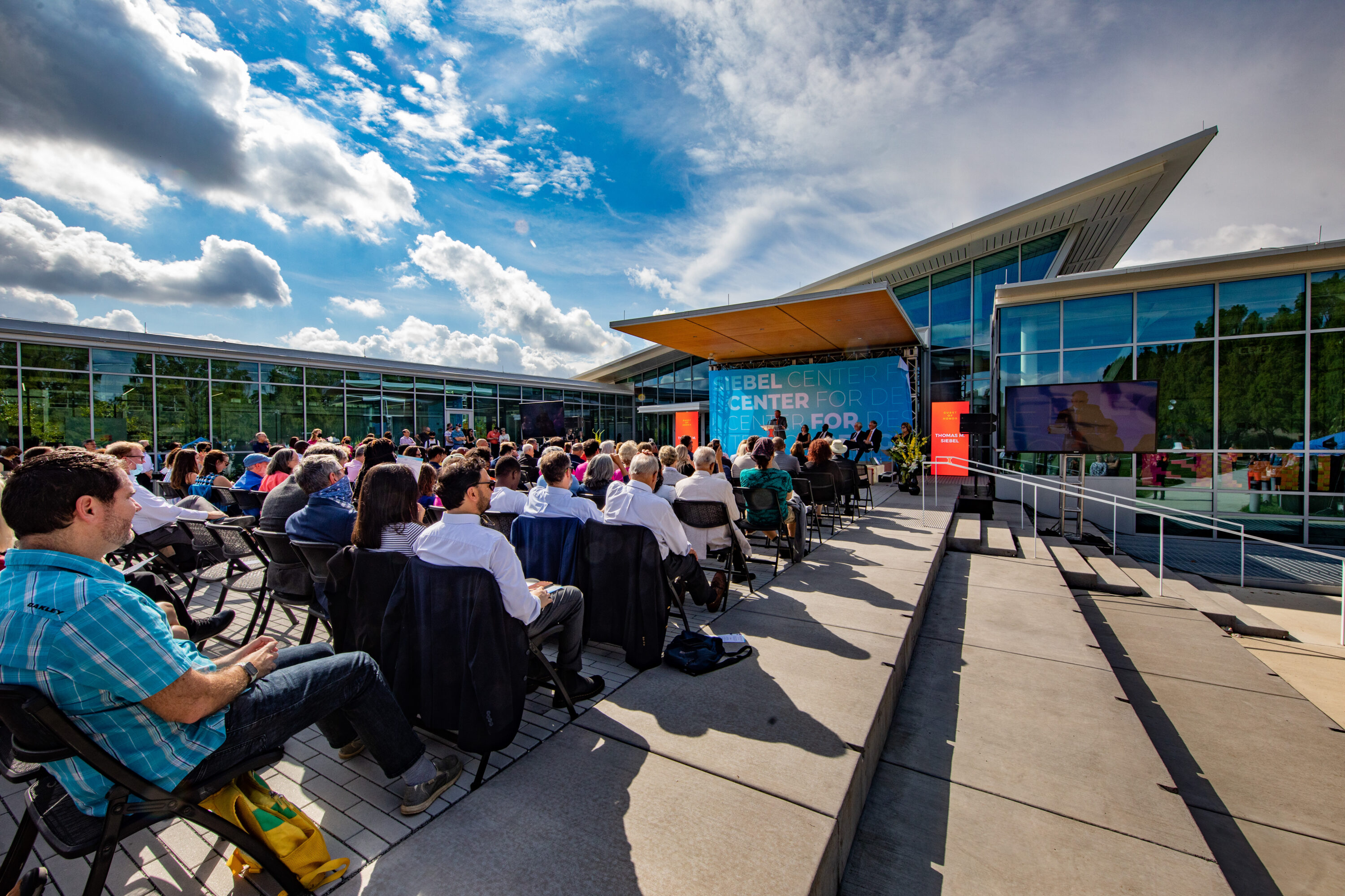 Guest of honor Tom Siebel joins dignitaries during building dedication ceremonies for the Siebel Center for Design.
Remarks were given by Siebel Center for Design’s director, Rachel Switzky, plus University of Illinois System President Timothy Killeen, UIUC Chancellor Robert Jones, and UIUC Provost Andreas Cangellaris. Tom Siebel delivered keynote remarks.
Following the ceremony, guests toured the center during open house festivities.
Thomas M. Siebel is the founder of C3 AI and has served as the chairman of the board of directors since January 2009 and as chief executive officer since July 2011. Prior to founding the company, Siebel founded and served as the chief executive officer of Siebel Systems, a global CRM software company, from 1993 until it merged with Oracle Corporation in January 2006. Siebel served in various leadership positions with Oracle Corporation from January 1984 to September 1990. Siebel serves as a member of the boards of advisors for the colleges of engineering at the University of Illinois Urbana-Champaign and the University of California, Berkeley.