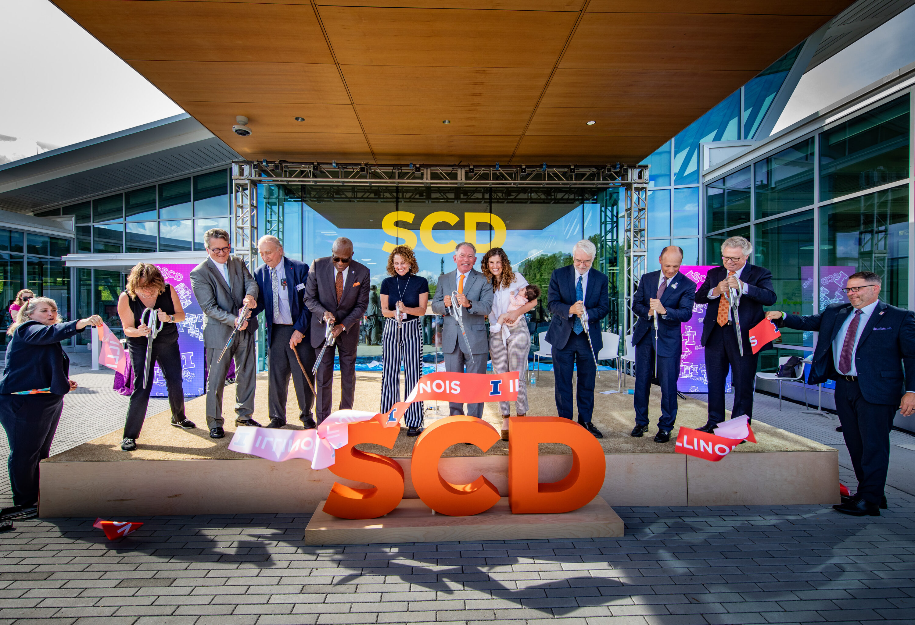 Guest of honor Tom Siebel joins dignitaries during building dedication ceremonies for the Siebel Center for Design.
Remarks were given by Siebel Center for Design’s director, Rachel Switzky, plus University of Illinois System President Timothy Killeen, UIUC Chancellor Robert Jones, and UIUC Provost Andreas Cangellaris. Tom Siebel delivered keynote remarks.
Following the ceremony, guests toured the center during open house festivities.
Thomas M. Siebel is the founder of C3 AI and has served as the chairman of the board of directors since January 2009 and as chief executive officer since July 2011. Prior to founding the company, Siebel founded and served as the chief executive officer of Siebel Systems, a global CRM software company, from 1993 until it merged with Oracle Corporation in January 2006. Siebel served in various leadership positions with Oracle Corporation from January 1984 to September 1990. Siebel serves as a member of the boards of advisors for the colleges of engineering at the University of Illinois Urbana-Champaign and the University of California, Berkeley.